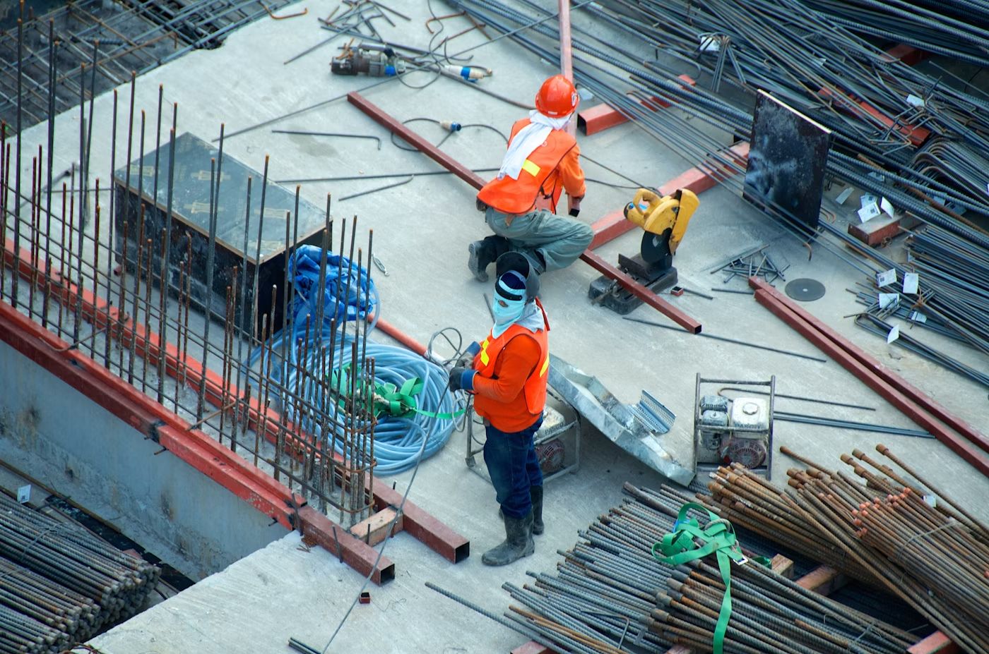 Construction cranes over a building site at dusk